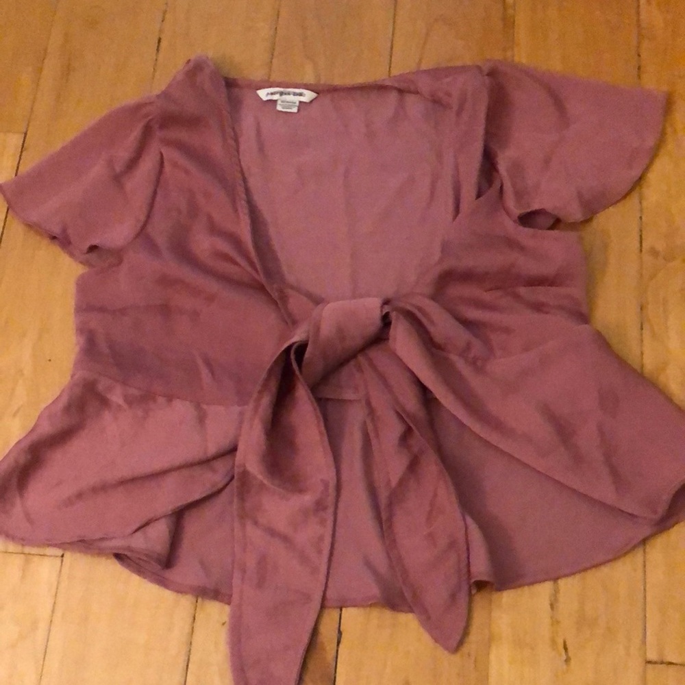 Dusty pink tie shirt with slight peplum detail